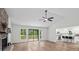 Bright living room with vaulted ceiling, stone fireplace, and sliding doors to the deck at 641 Charing Cross Dr, Marietta, GA 30066