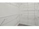 Walk-in closet with white wire shelving and carpeted floor offers ample storage at 641 Charing Cross Dr, Marietta, GA 30066