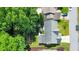 Aerial view of house with backyard patio, landscaping, and nearby trees at 70 Parkside Cir, Marietta, GA 30068