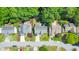 Aerial view of neighborhood with houses, driveways, and mature trees at 70 Parkside Cir, Marietta, GA 30068