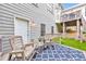 Backyard patio with rocking chairs and blue rug at 70 Parkside Cir, Marietta, GA 30068
