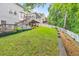 Backyard view with multilevel decks, fence, and landscaping at 70 Parkside Cir, Marietta, GA 30068