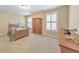 Cozy bedroom with a twin bed, classic wooden furniture, and natural light creating a warm and inviting space at 70 Parkside Cir, Marietta, GA 30068
