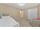 A cozy bedroom features carpet floors, a ceiling light, and a comfortable-looking bed with white linen at 70 Parkside Cir, Marietta, GA 30068