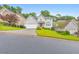 Charming two-story home with a well-manicured lawn, gray exterior, and red front door at 70 Parkside Cir, Marietta, GA 30068