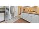 Eat-in kitchen with stainless steel appliances, white cabinets, and adjacent breakfast area at 70 Parkside Cir, Marietta, GA 30068