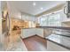 Bright, updated kitchen with white cabinets, stainless appliances, and open access to other living areas at 70 Parkside Cir, Marietta, GA 30068
