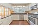 Modern kitchen with stainless steel appliances, granite countertops, and natural lighting at 70 Parkside Cir, Marietta, GA 30068