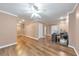 Open living room space with hardwood floors, recessed lights, and a ceiling fan, ideal for flexible living at 70 Parkside Cir, Marietta, GA 30068