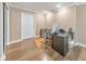Bright home office features a modern desk setup with hardwood floors and plenty of natural light at 70 Parkside Cir, Marietta, GA 30068