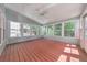 Bright sunroom with wood floors, large windows, and a ceiling fan offers an inviting space at 70 Parkside Cir, Marietta, GA 30068