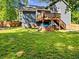 The backyard has a wooden deck, privacy fence, and lush grass at 2723 Horseshoe Creek Sw Dr, Marietta, GA 30064