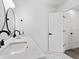 Bathroom featuring double sinks, marble floors, and updated fixtures at 2723 Horseshoe Creek Sw Dr, Marietta, GA 30064