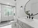 Bathroom featuring glass enclosed shower and modern fixtures at 2723 Horseshoe Creek Sw Dr, Marietta, GA 30064