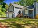 Inviting home showcasing a well-manicured lawn, decorative features, and a classic architectural style at 2723 Horseshoe Creek Sw Dr, Marietta, GA 30064