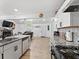 Stylish kitchen with stainless steel appliances, granite countertops, and an open view to the living room at 2723 Horseshoe Creek Sw Dr, Marietta, GA 30064