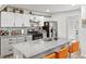 Bright kitchen with granite counters, white cabinets, and stainless steel appliances at 2723 Horseshoe Creek Sw Dr, Marietta, GA 30064