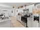 Modern kitchen featuring stainless steel appliances and light wood flooring at 2723 Horseshoe Creek Sw Dr, Marietta, GA 30064