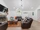 Inviting living room with vaulted ceiling, fireplace, and views of the entryway and stairway at 2723 Horseshoe Creek Sw Dr, Marietta, GA 30064