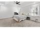 Spacious main bedroom with tray ceilings, fan, and plenty of natural light at 2723 Horseshoe Creek Sw Dr, Marietta, GA 30064