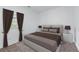 Bedroom featuring neutral tones, natural lighting, and simple, clean lines at 3422 Hopi Pt, Lawrenceville, GA 30044