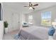 Bedroom with white walls and furnishings, a ceiling fan, and natural light from the windows at 3422 Hopi Pt, Lawrenceville, GA 30044