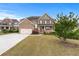 Charming two-story home with brick accents, a well-manicured lawn and lovely landscaping at 3422 Hopi Pt, Lawrenceville, GA 30044