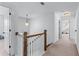 Upstairs hallway with white trim, neutral carpet, and natural light at 3422 Hopi Pt, Lawrenceville, GA 30044