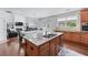 Gourmet kitchen with granite countertops, an island, stainless steel appliances, and an open floor plan at 3422 Hopi Pt, Lawrenceville, GA 30044