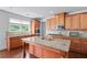 Spacious kitchen featuring hardwood floors, ample cabinets, granite countertops, and stainless steel appliances at 3422 Hopi Pt, Lawrenceville, GA 30044