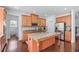 Gourmet kitchen with granite countertops, wood cabinets, and stainless steel appliances at 3422 Hopi Pt, Lawrenceville, GA 30044