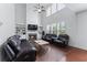 Bright living room with high ceilings, large windows, fireplace, and hardwood floors at 3422 Hopi Pt, Lawrenceville, GA 30044