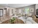 Open-concept living room with wood floors, neutral-toned furniture, and plenty of natural light at 3422 Hopi Pt, Lawrenceville, GA 30044