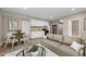 Open living space featuring a kitchen, table, and seating area at 3422 Hopi Pt, Lawrenceville, GA 30044