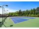 Well-maintained tennis courts with lighting for evening play at 3422 Hopi Pt, Lawrenceville, GA 30044