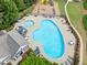 Aerial view features the community pool, kiddie pool, playground and comfortable seating for residents at 121 Camdyn Cir, Woodstock, GA 30188