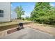 Backyard featuring a concrete patio, grassy area, and mature trees; ideal for outdoor enjoyment at 121 Camdyn Cir, Woodstock, GA 30188