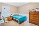 Cozy bedroom with natural light, a bed with a blue comforter, and classic wooden furnishings at 121 Camdyn Cir, Woodstock, GA 30188