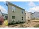 Exterior view of the home featuring well-maintained siding and a spacious yard at 121 Camdyn Cir, Woodstock, GA 30188