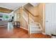 Open foyer featuring hardwood flooring, a staircase, and seamless access to the living spaces at 121 Camdyn Cir, Woodstock, GA 30188