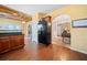 Kitchen with wood cabinets, wood flooring, and black appliances, with an unfinished ceiling at 121 Camdyn Cir, Woodstock, GA 30188