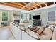 Inviting living room with large sectional, fireplace, and natural light at 121 Camdyn Cir, Woodstock, GA 30188