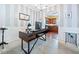 Home office with stylish desk, striped wallpaper, and view into the kitchen at 121 Camdyn Cir, Woodstock, GA 30188