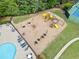 Community playground featuring slides, swings, and climbing structures, perfect for Gathering fun and activities at 121 Camdyn Cir, Woodstock, GA 30188