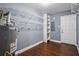 Unfinished basement with wood floors, shelves, hot water heater and storage, ready for customization at 2240 Clanton Ter, Decatur, GA 30034