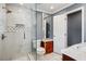 Bathroom with updated glass shower, modern fixtures, white marble-style tiles, and a custom wood vanity at 2240 Clanton Ter, Decatur, GA 30034