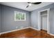 Cozy bedroom with wood floors, neutral walls, a ceiling fan and a bright window and closet at 2240 Clanton Ter, Decatur, GA 30034
