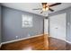 Bedroom featuring hardwood floors, neutral walls, a bright window and a closet at 2240 Clanton Ter, Decatur, GA 30034