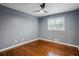 Bedroom featuring hardwood floors, a ceiling fan, a window with blinds and neutral wall paint at 2240 Clanton Ter, Decatur, GA 30034