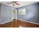 Bedroom featuring hardwood floors, a ceiling fan, a bright window and a closet at 2240 Clanton Ter, Decatur, GA 30034